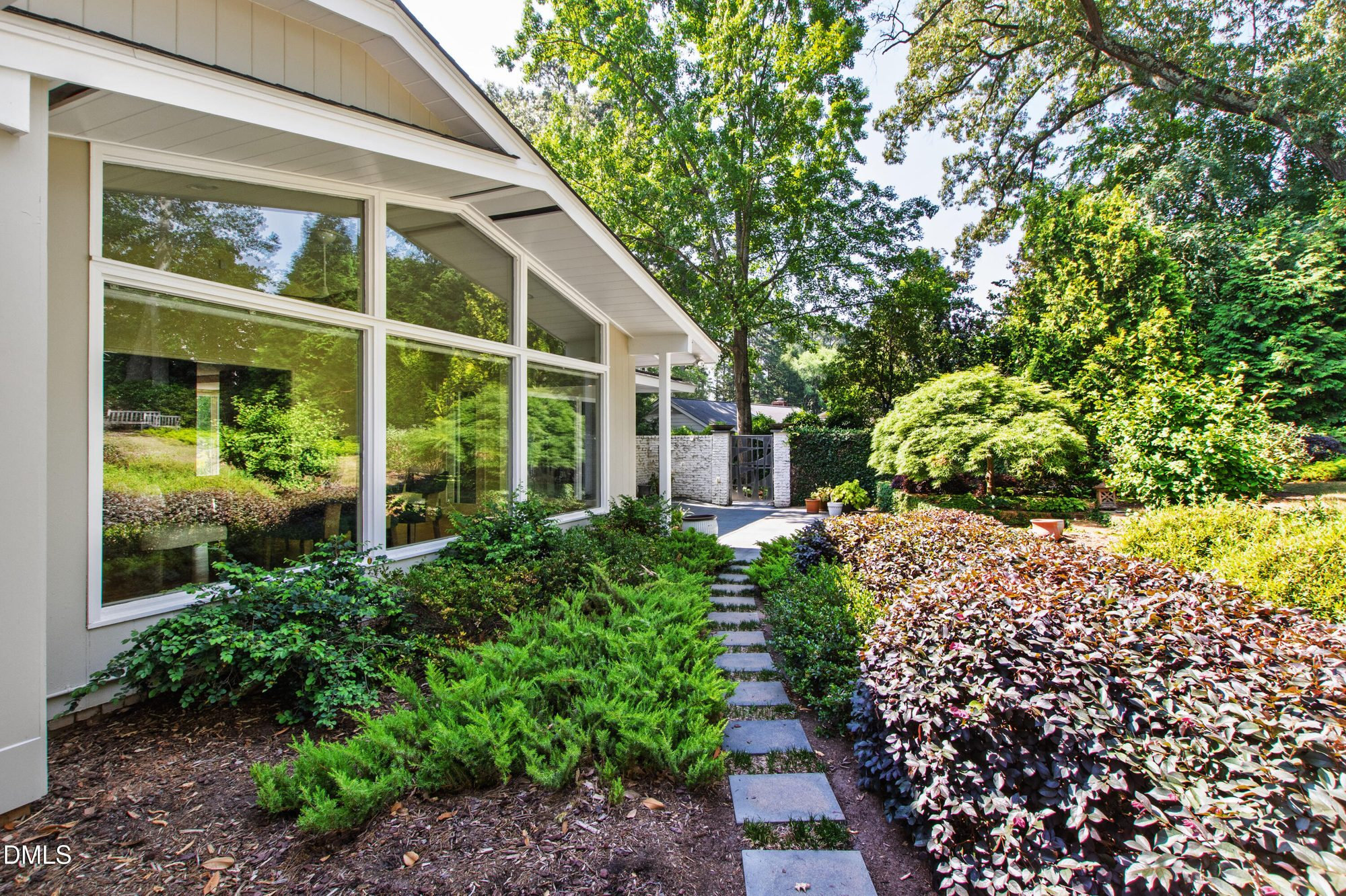 The stone path through Arthur McKimmon's gardens alongside the window wall